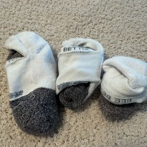 White and Gray women’s med Bombas Socks
